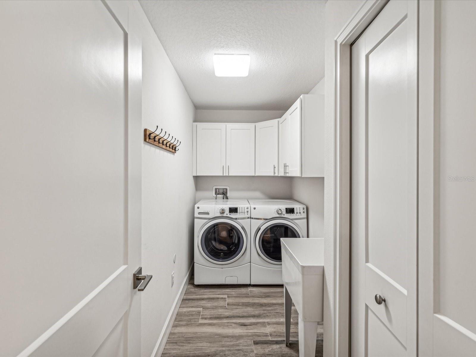 Laundry with mop sink & closet