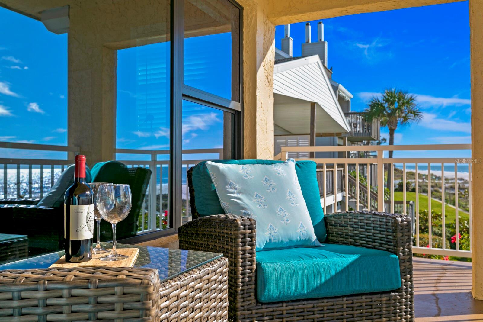Second level balcony overlooks the sand, the beach, and the stunning sunsets.  The epitome of coastal living!