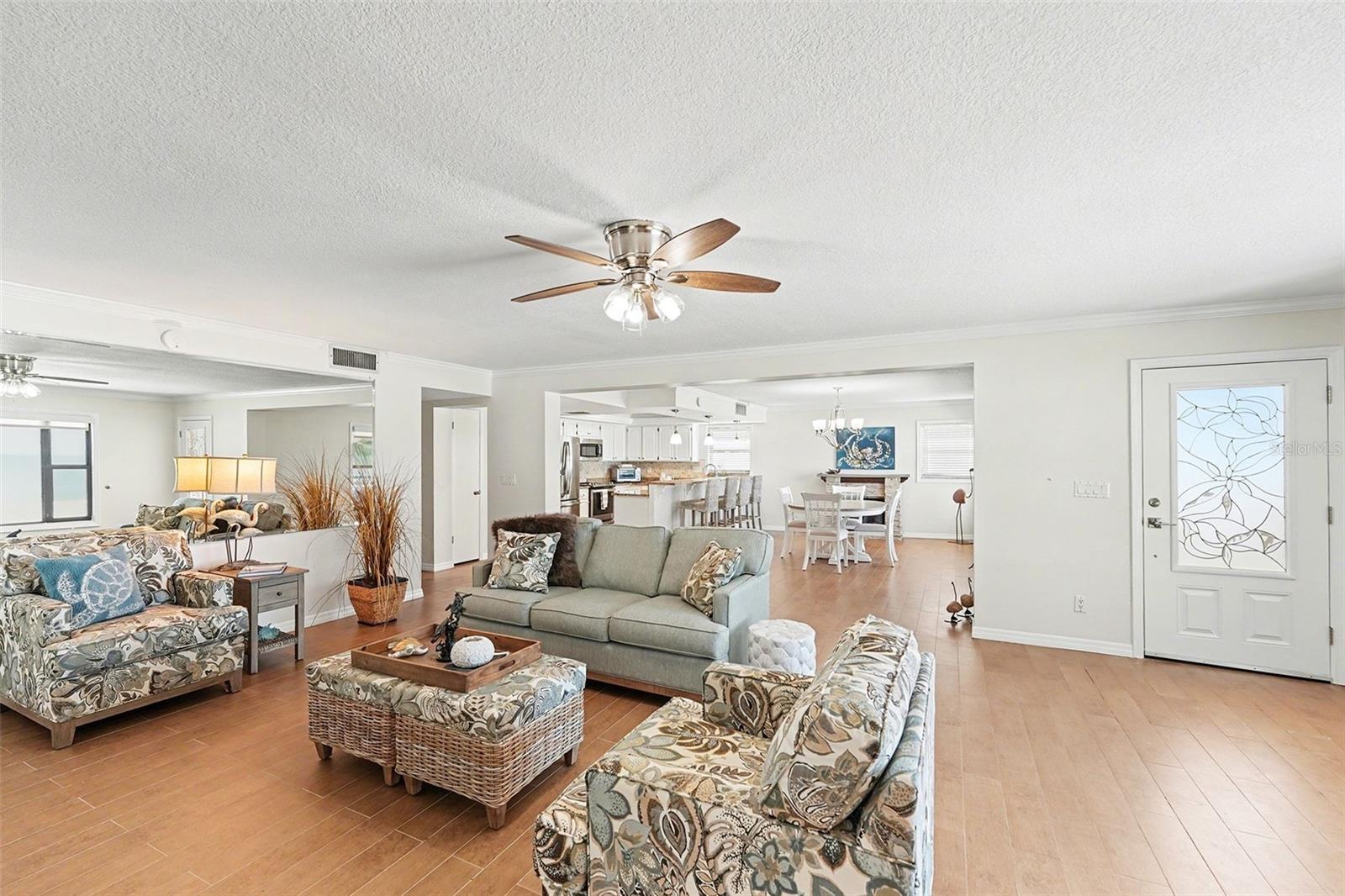 Enjoy the second level with its open design concept with a combined living room, kitchen, large dining room, and fireplace.  Large picture windows are in each room with remote shades and frame the beautiful and unique sunsets each evening.