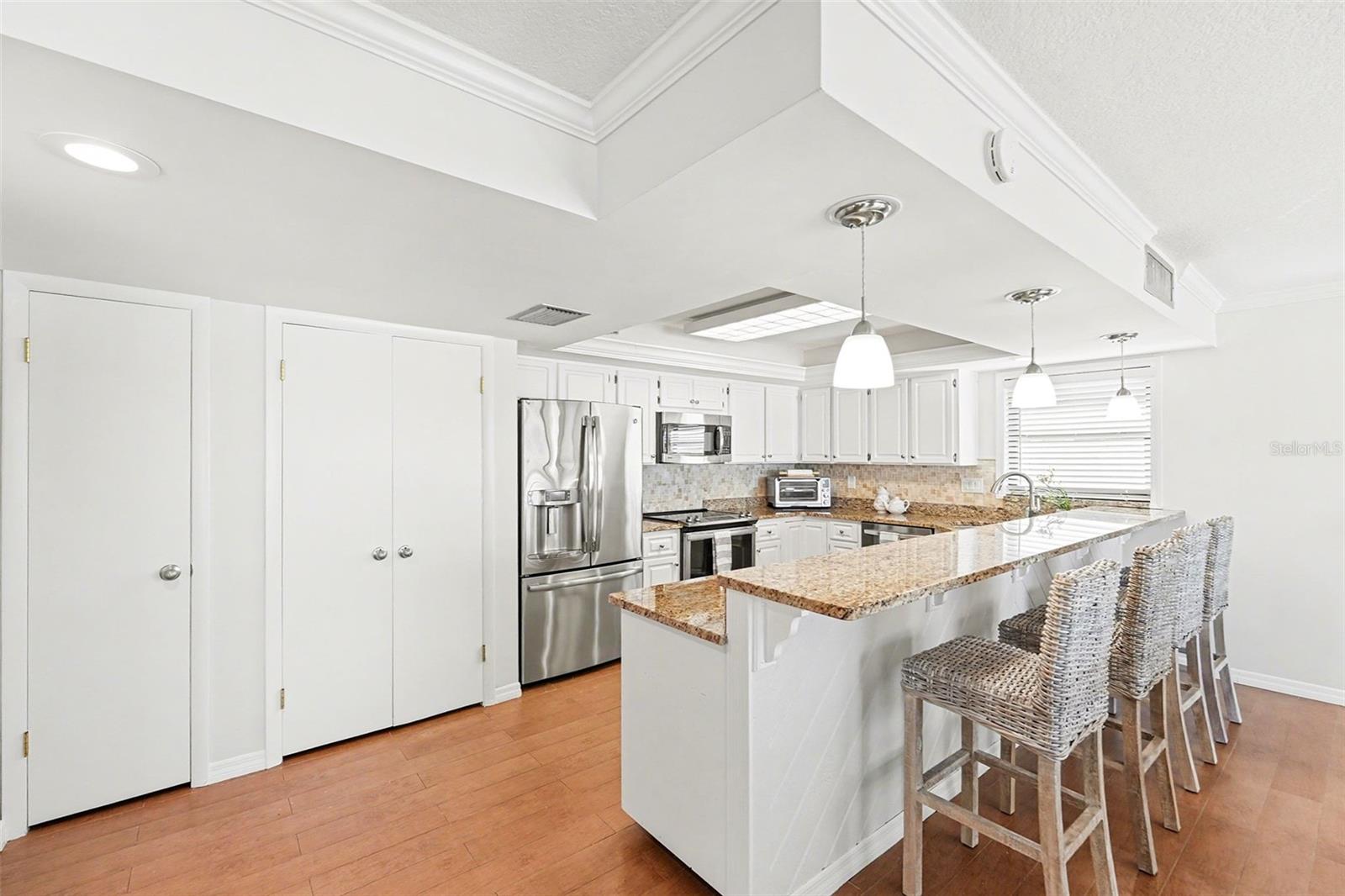 Plenty of storage with large pantry utility closet, and ample kitchen cabinets.