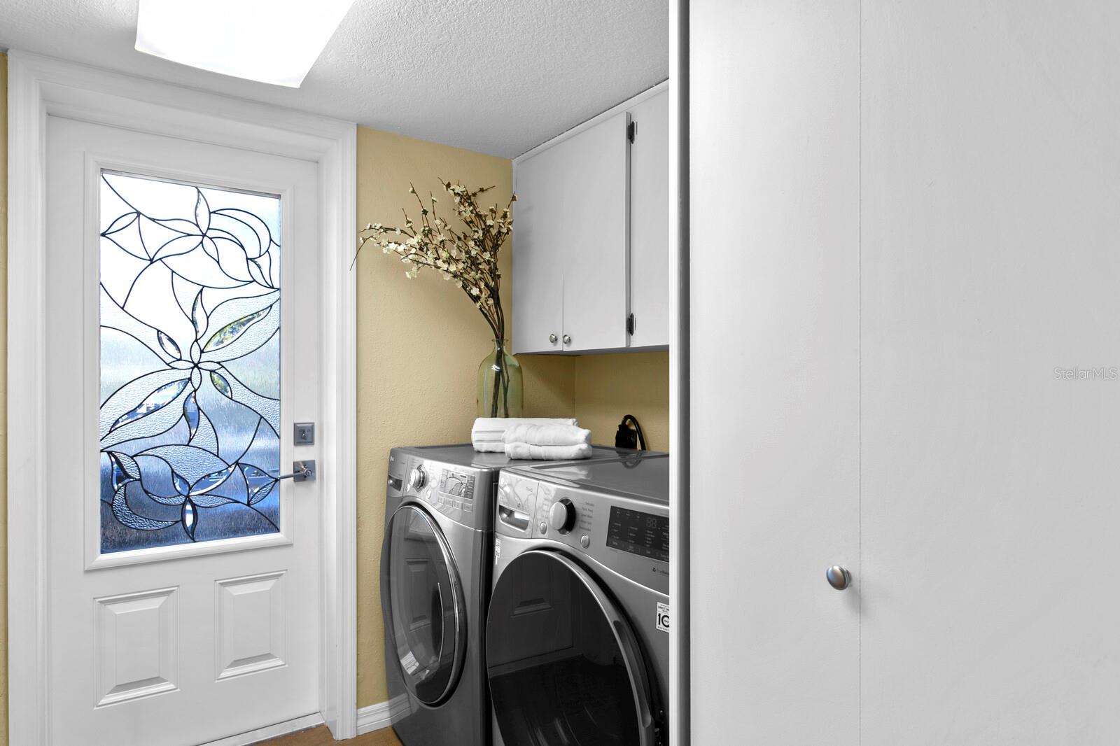 Second level laundry room.  Door leads to east facing balcony with partial Intracoastal views.