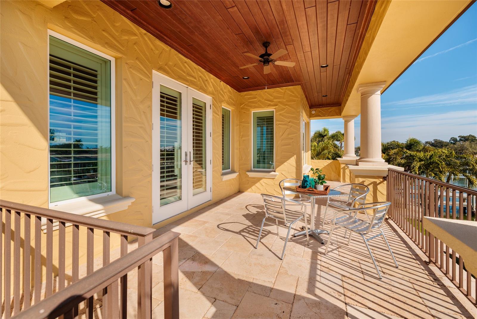 Dine al fresco on the balcony overlooking your waterfront playground.