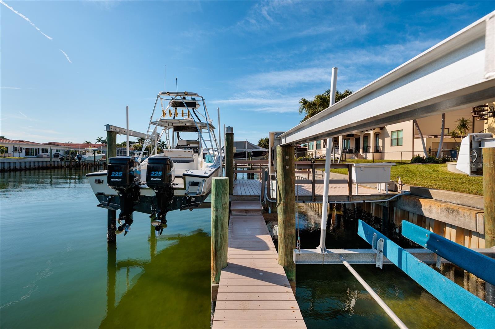 2 Boat Lifts with new cables. 12K and 6K pounds. Composite dock, wrapped pilings, water and electric.