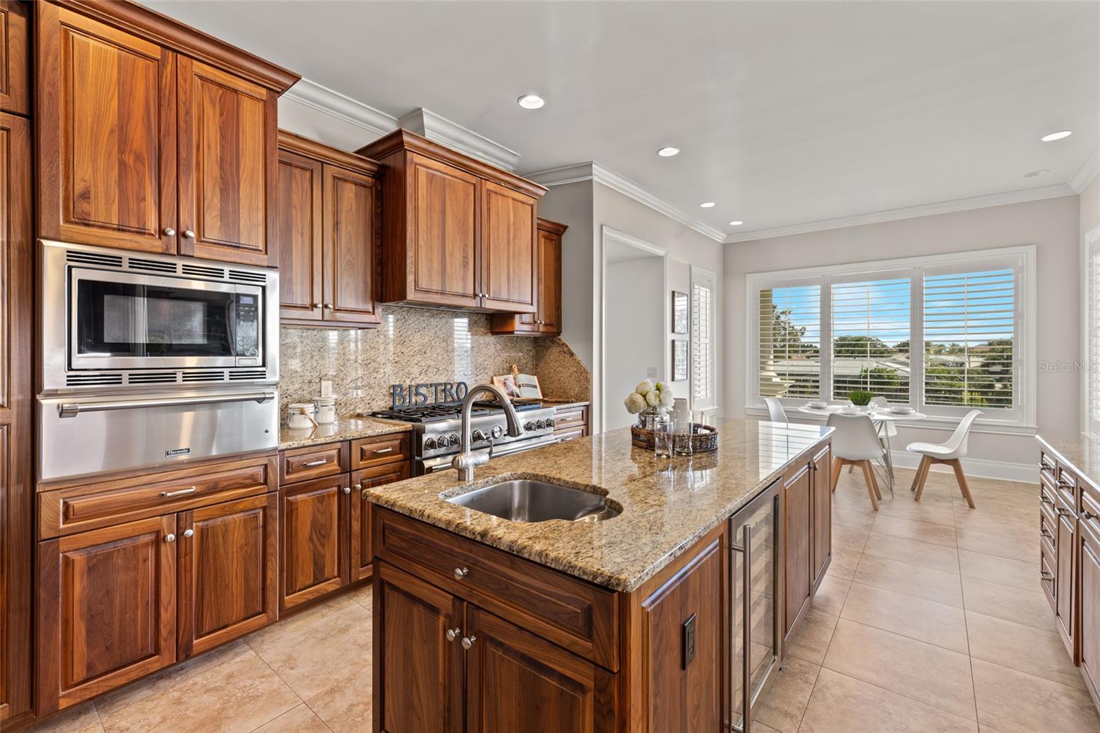 It's a COMPLETE Chef's Kitchen! Center island with wine cooler, prep sink and under storage ALL around.