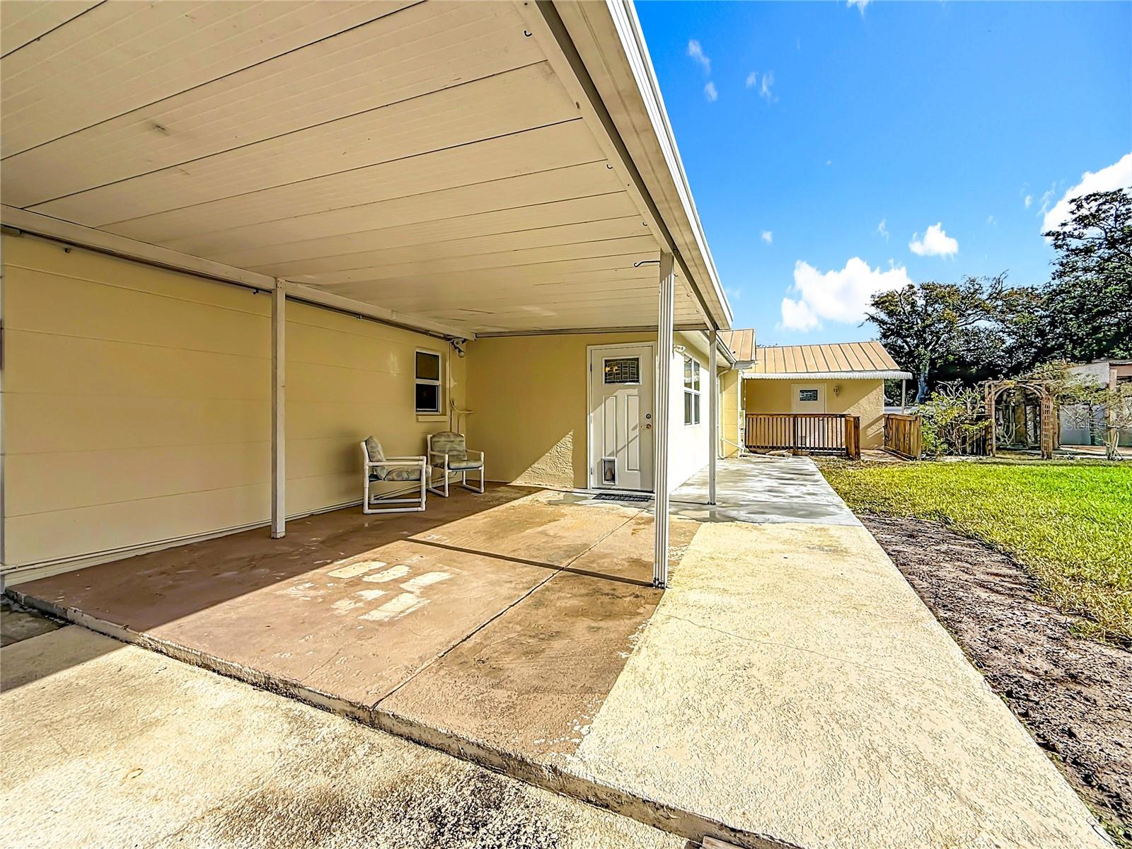 Covered back patio looking at Family room door