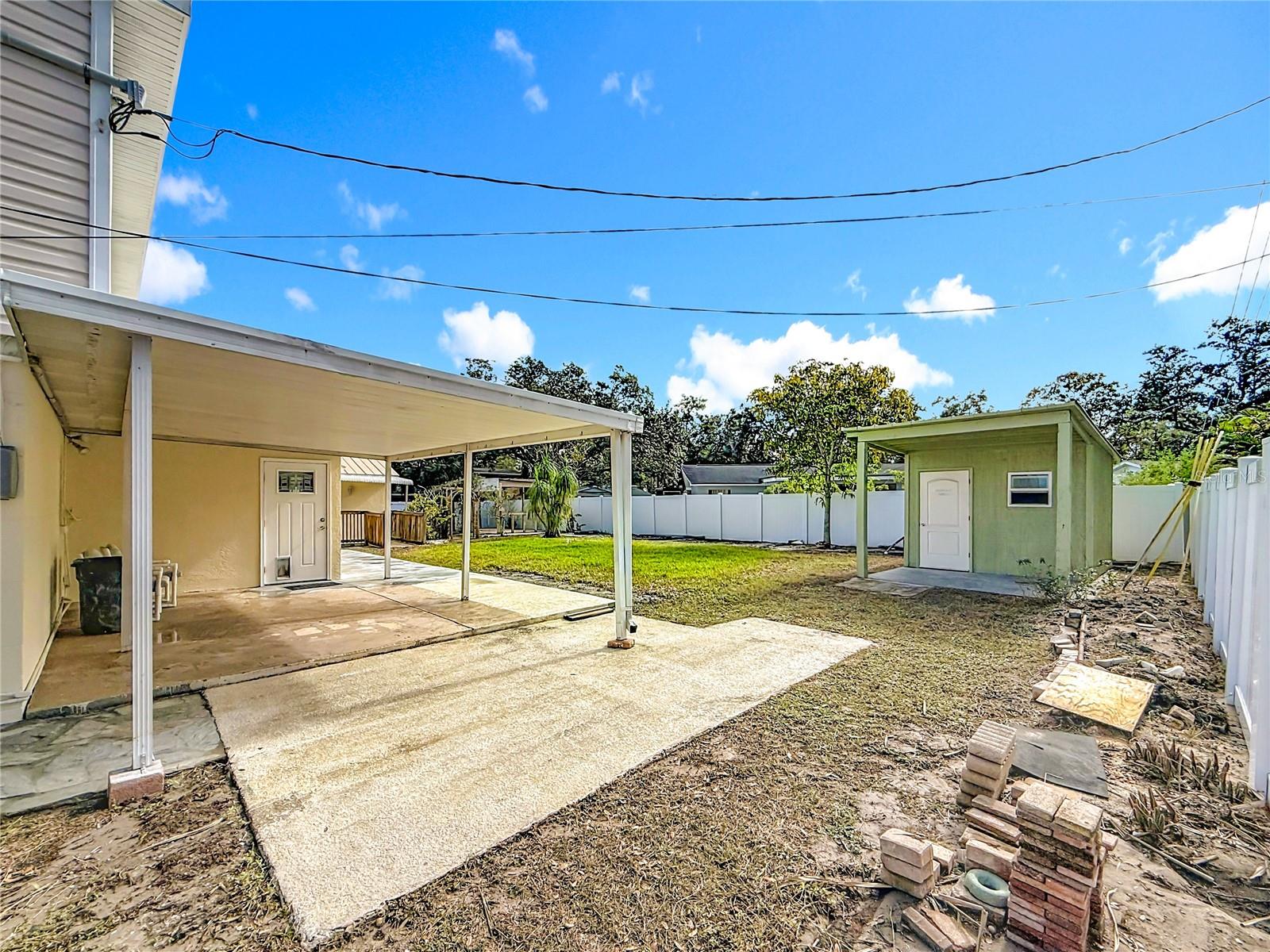 Covered back patio looking at Family room door