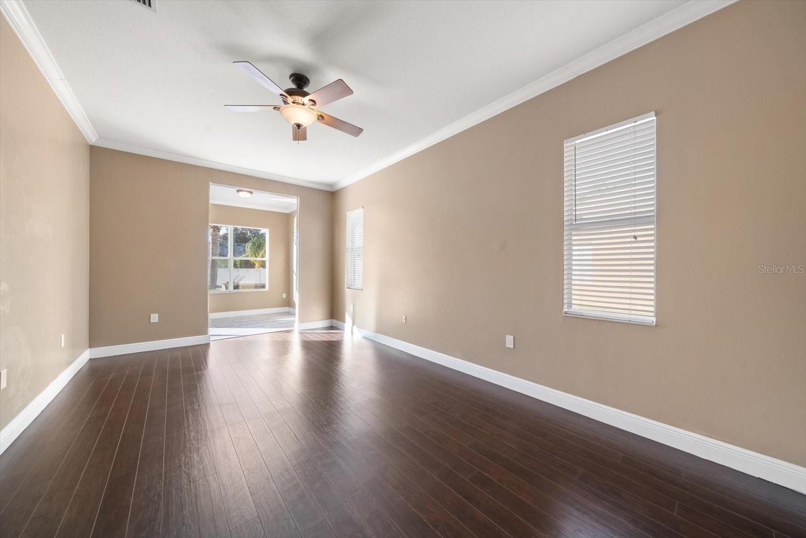 Primary Bedroom with wood flooring