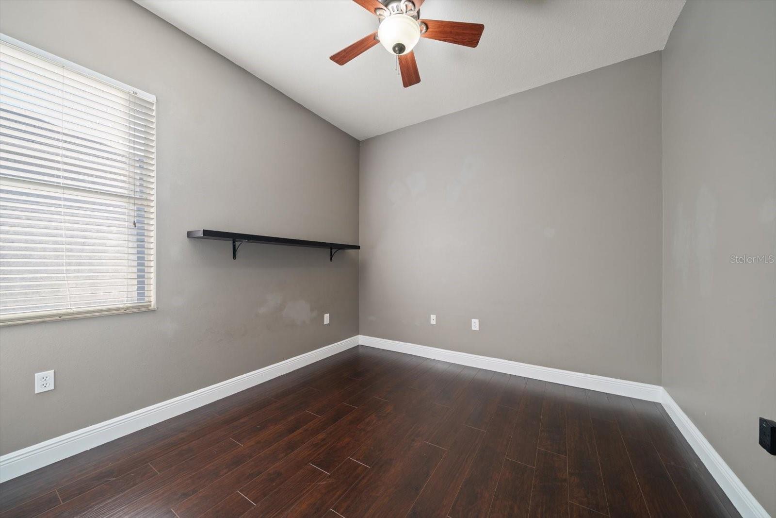 Bedroom 3 with wood flooring