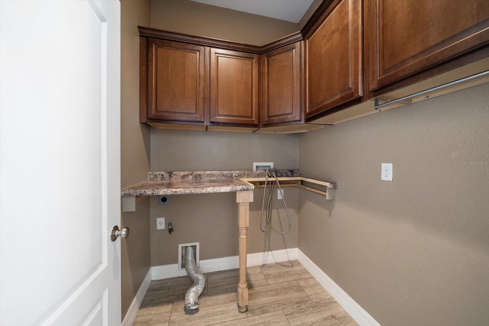 Separate Utility with Granite countertops and plenty of Storage