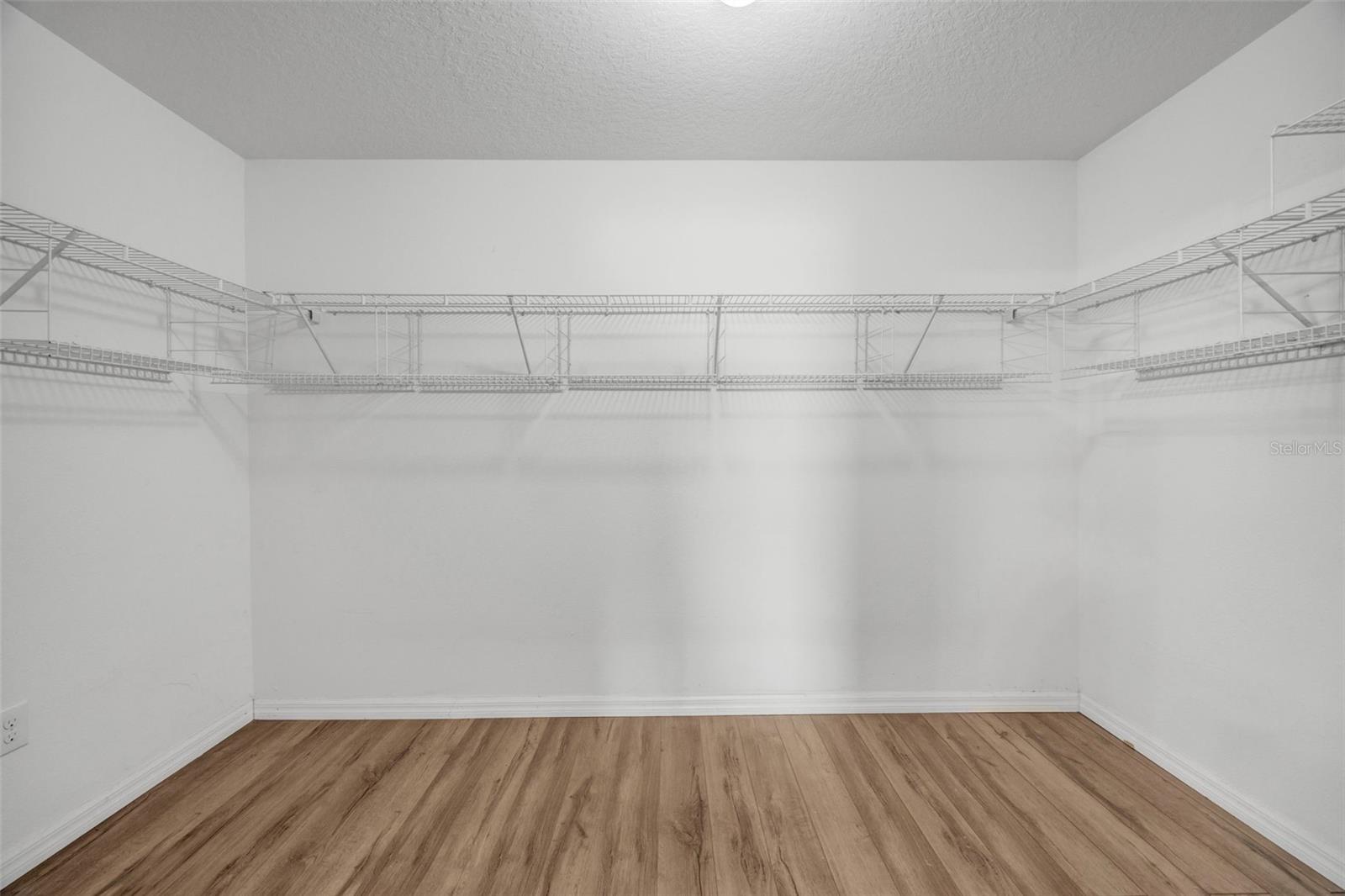 Large Primary En Suite Bathroom w/ dual sinks, walk in shower, and huge closet!