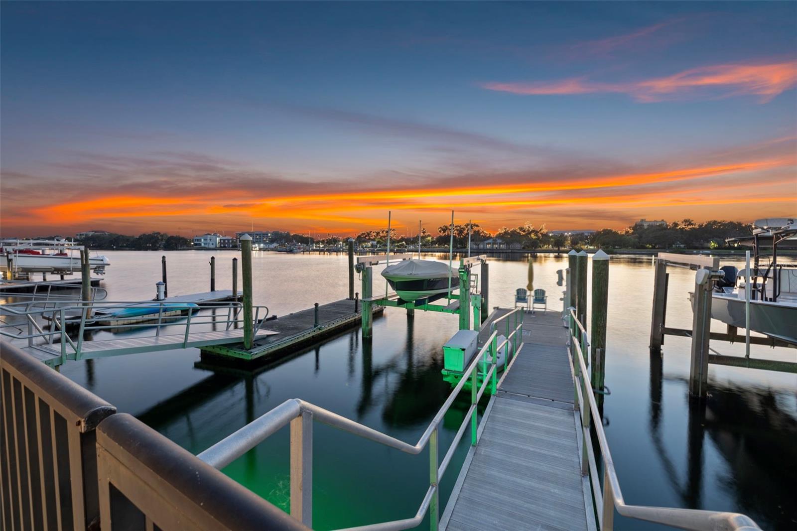 Endless evenings on the water, framed by a glowing sky and your private dock.