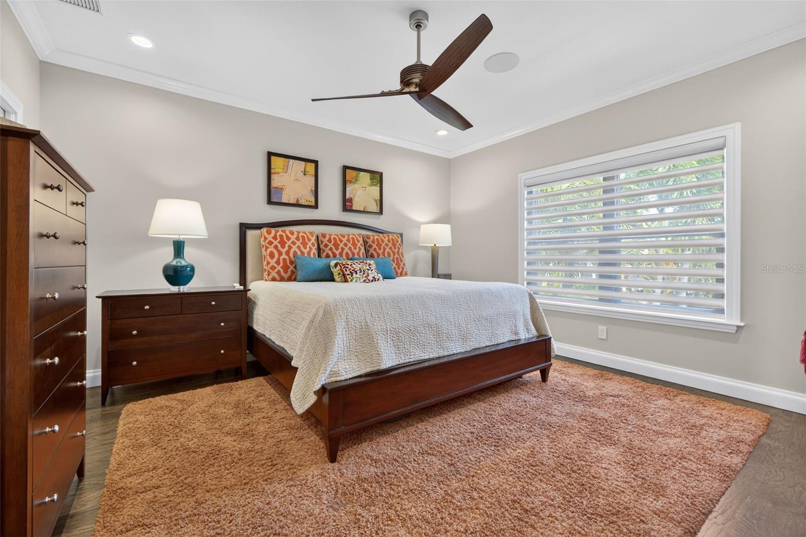 Well-sized guest bedroom with refined finishes and abundant natural light.