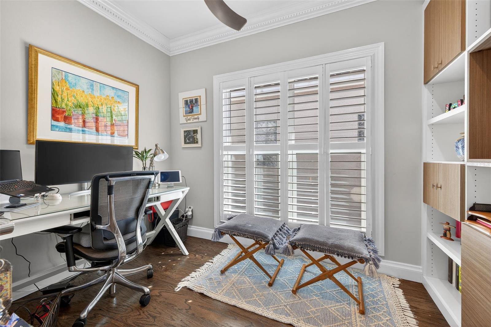 A dedicated home office with custom cabinets, perfect for productivity and style.