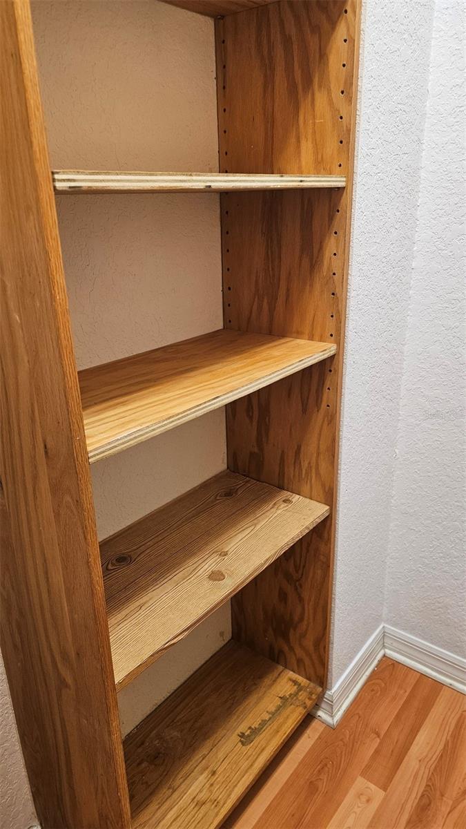 SHELVES & ENCLOSED STOR WITH SAFE IN LAUNDRY RM
