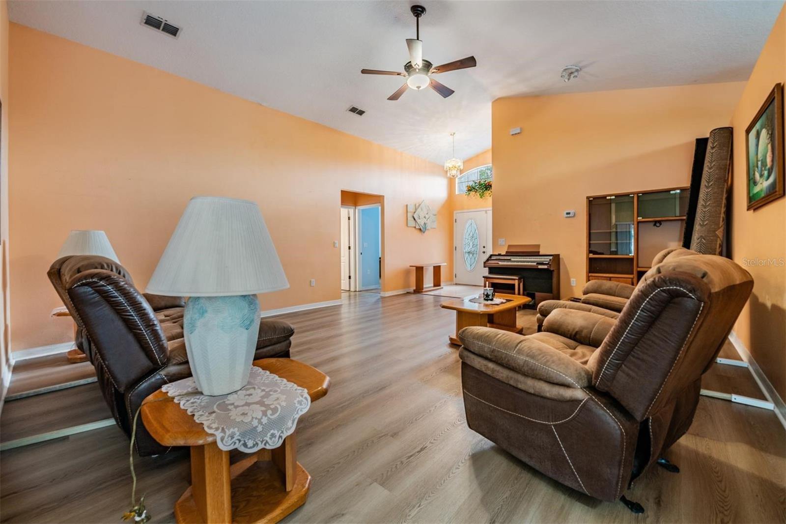 Lounge at the far end of the Great room to see the hallway with 2 bedrooms and 1 full bath.  The double front doors have their own entrance area out of the Great room.