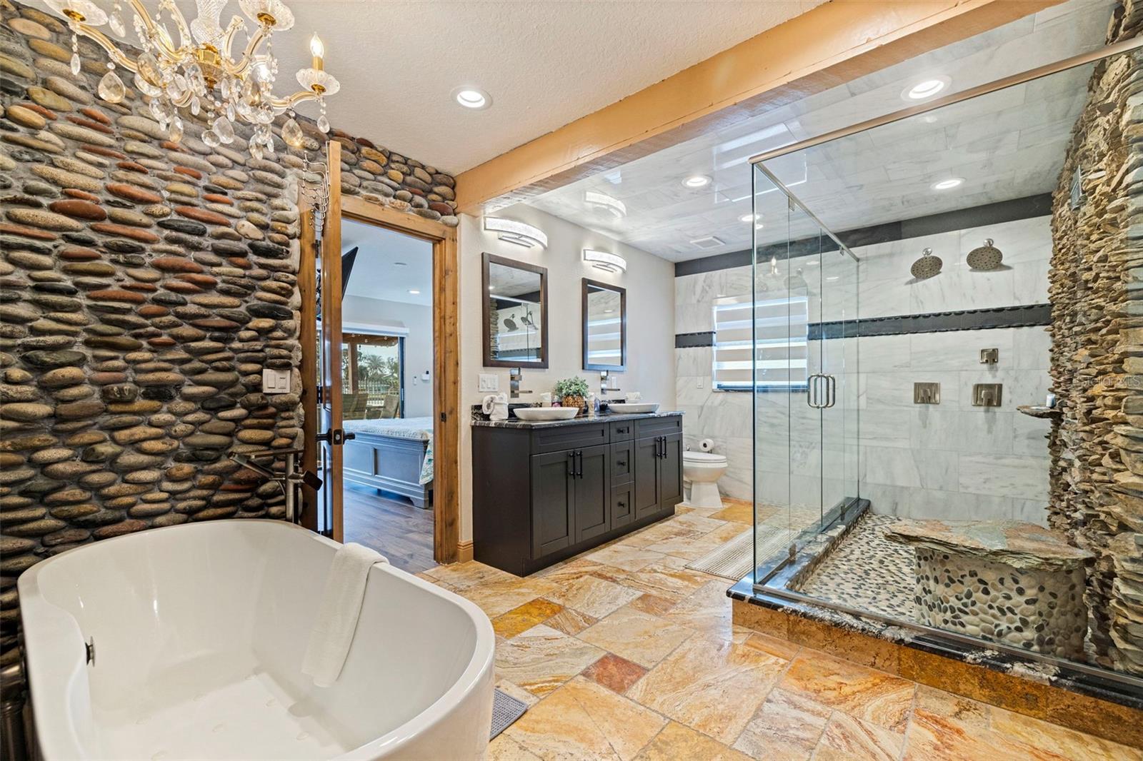Soaking Tub and Walk-in Shower with multiple heads including fountain