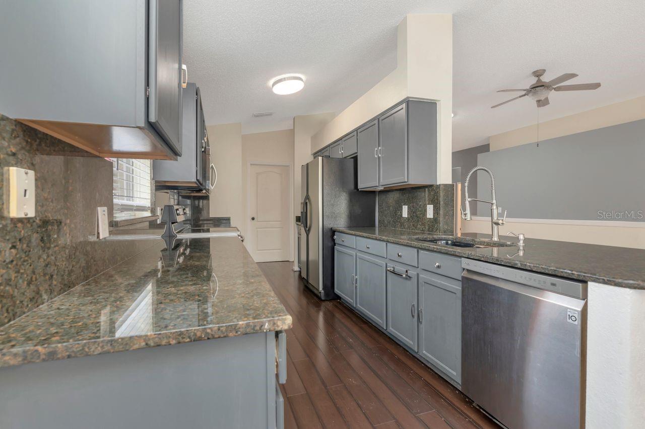 Kitchen with granite counters and stainless steel appliances