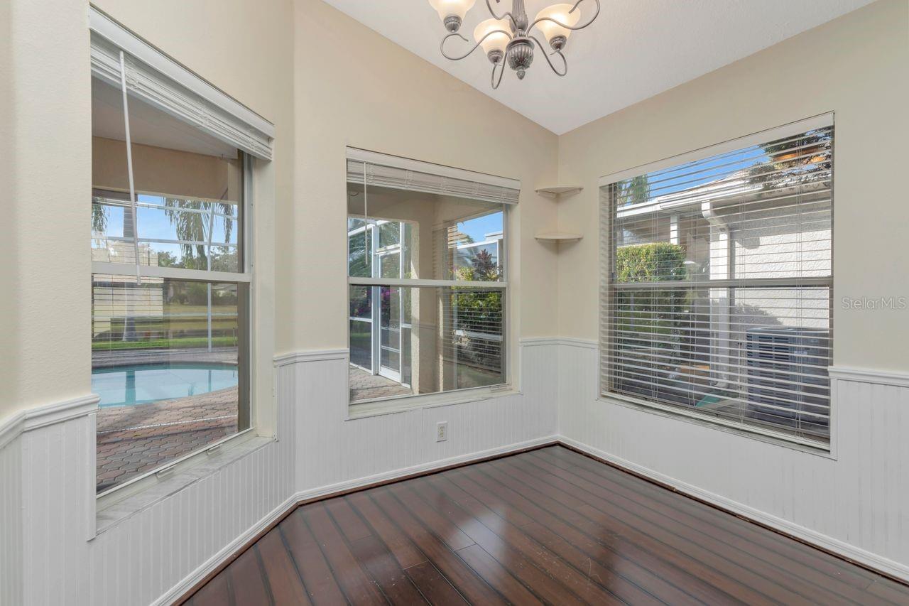 Breakfast nook overlooking the pool with lots of natural light