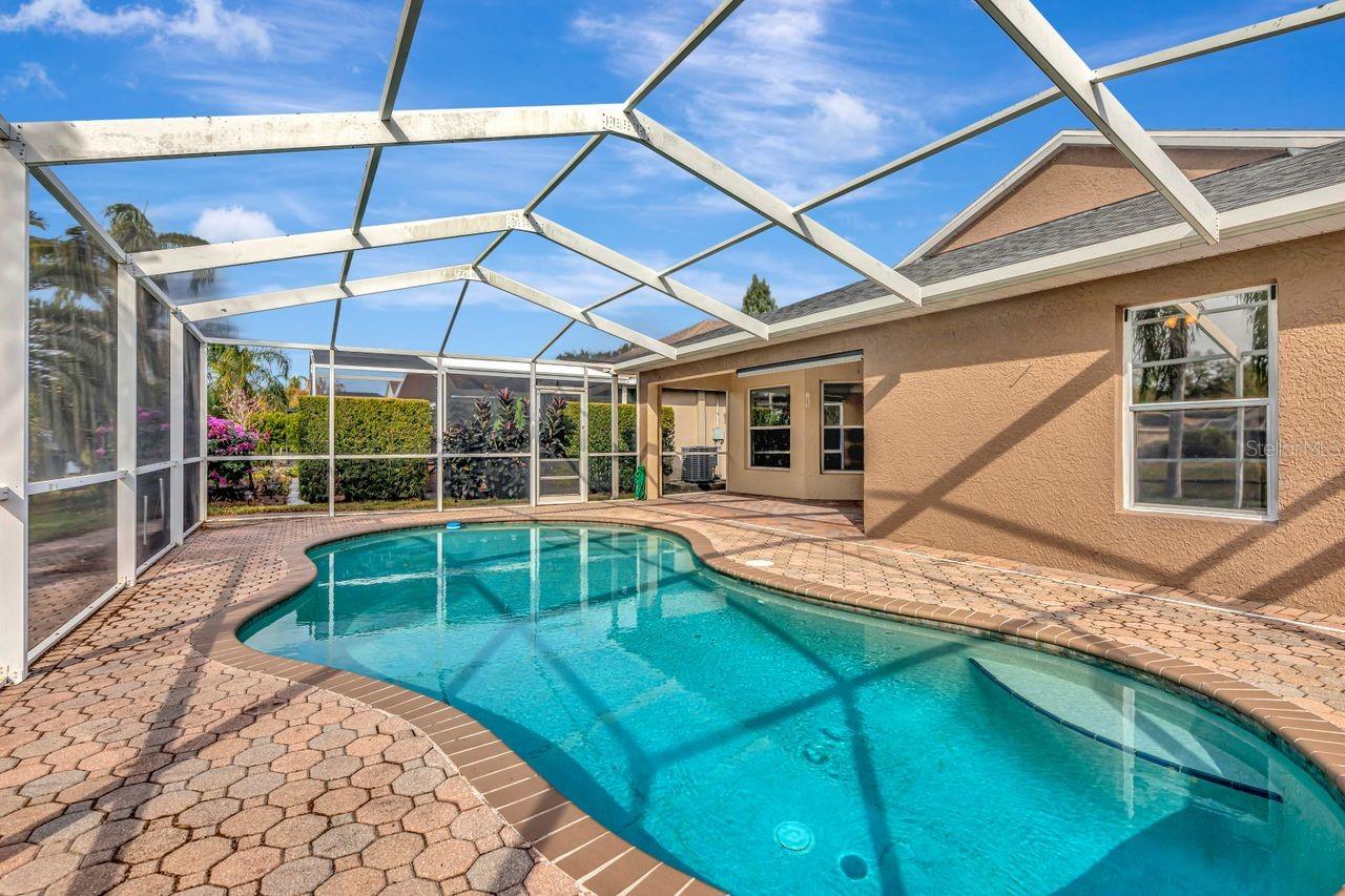 Pool with pavered lanai and outdoor space