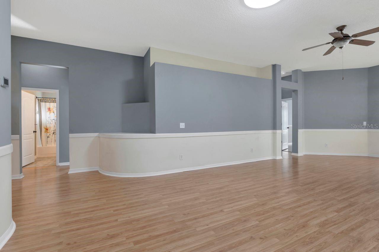 Large, Open Living space with high ceilings and accent walls