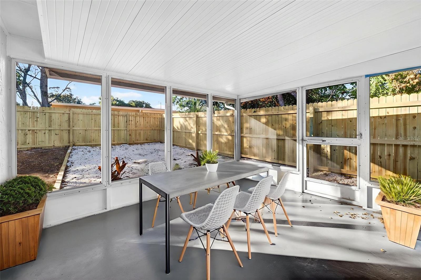 Screened back porch (photo is virtually staged)