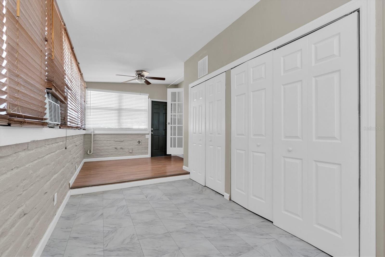 This room is cooled by a window unit , but the rest of the house has central A/C.