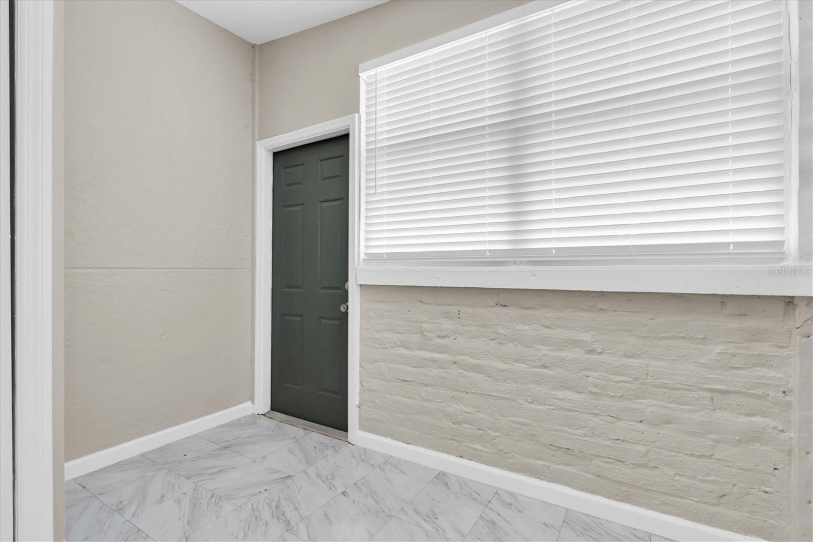 Bedroom three has a private exit to the front yard.