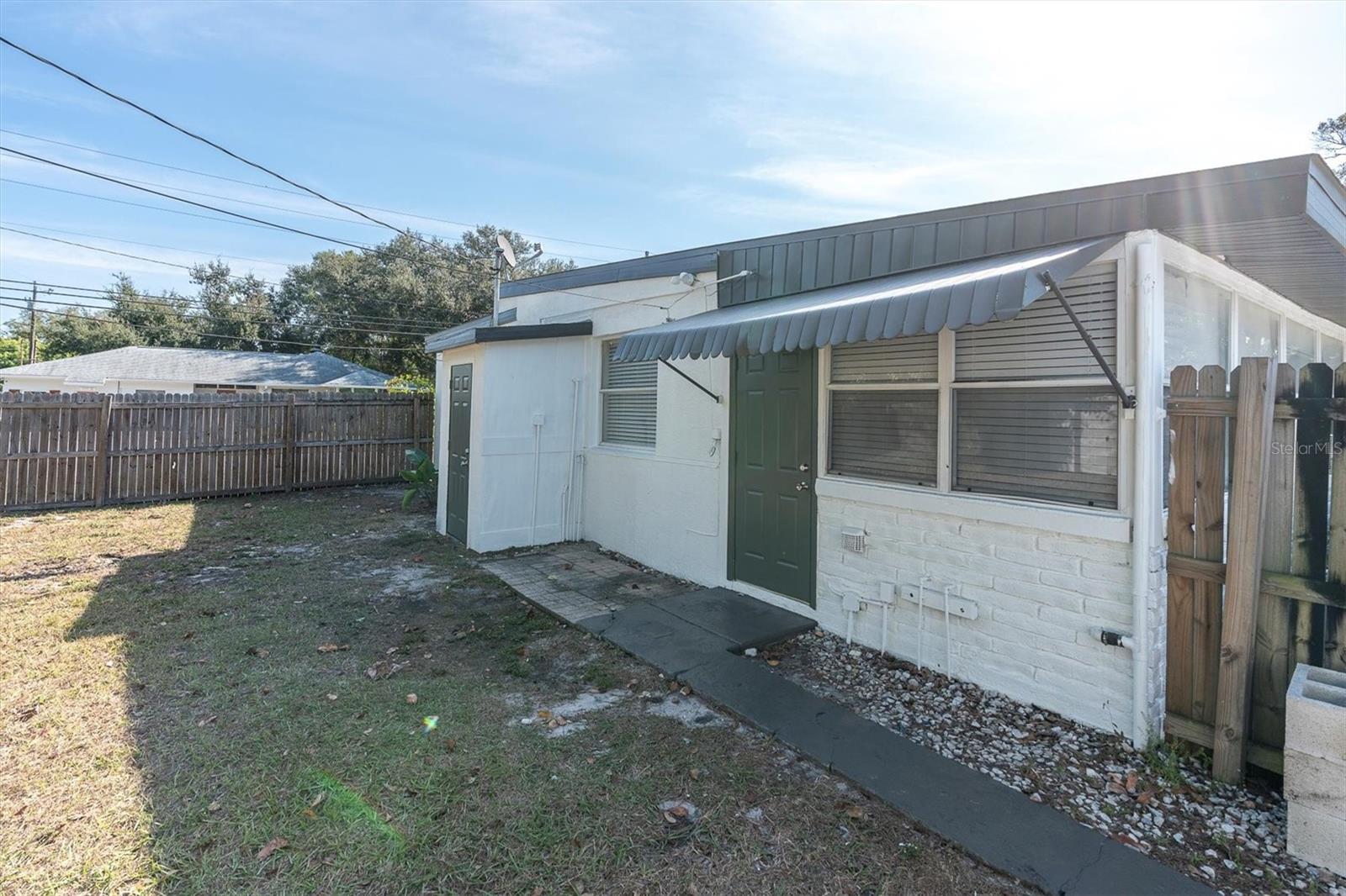 On the back of the house is a storage closet.