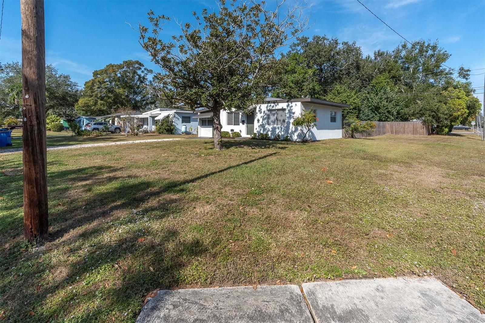 Situated on a large corner lot which allows for parking possibilities for a boat or an RV in the back yard.