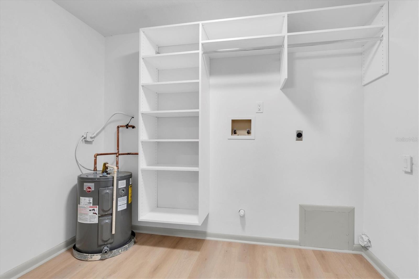 The large laundry room is adjacent to the kitchen.