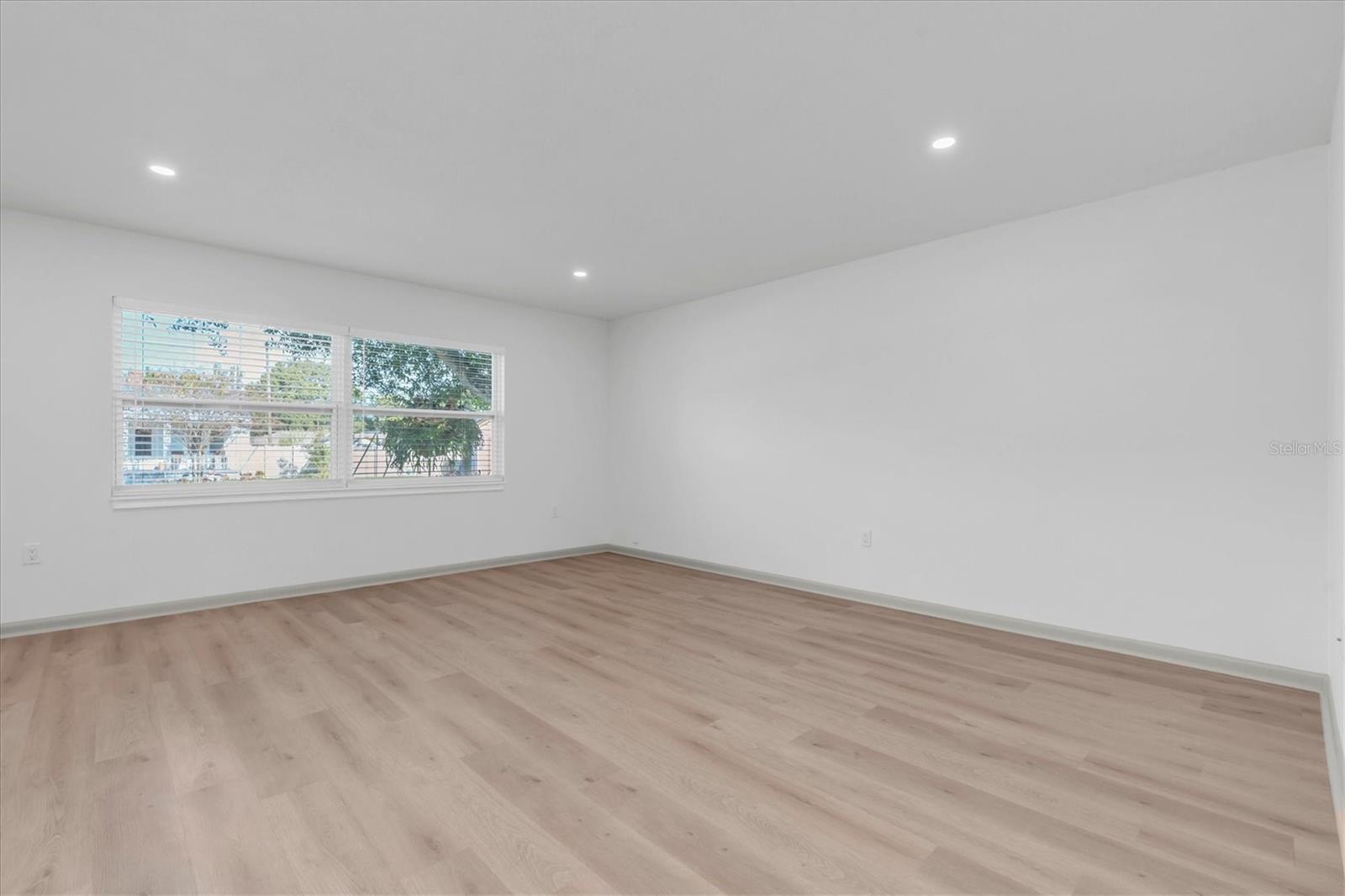 The living room has new recessed lighting.