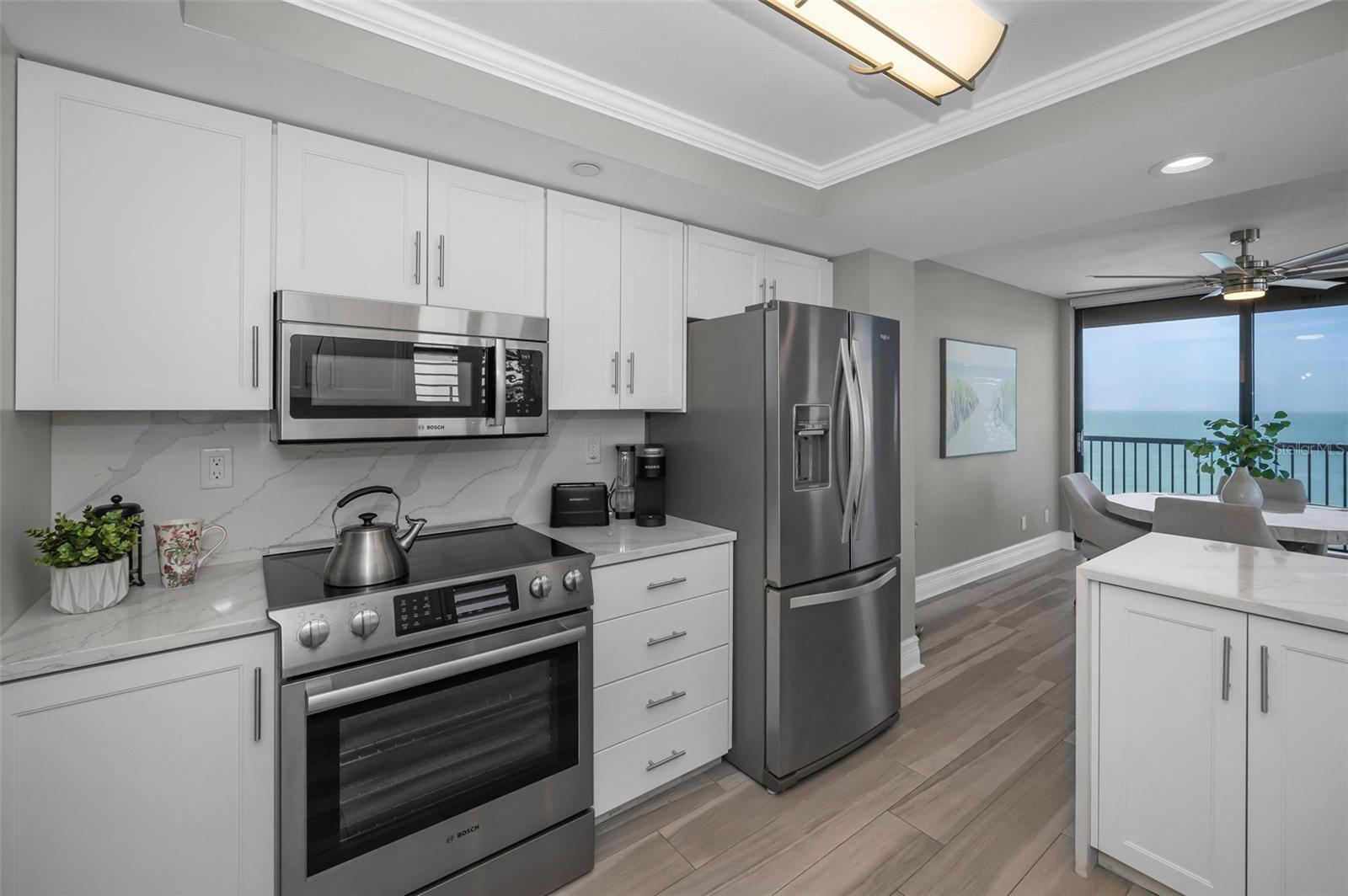 The beautifully renovated Kitchen with the adjacent Sun-Filled Dining area / Flex Room