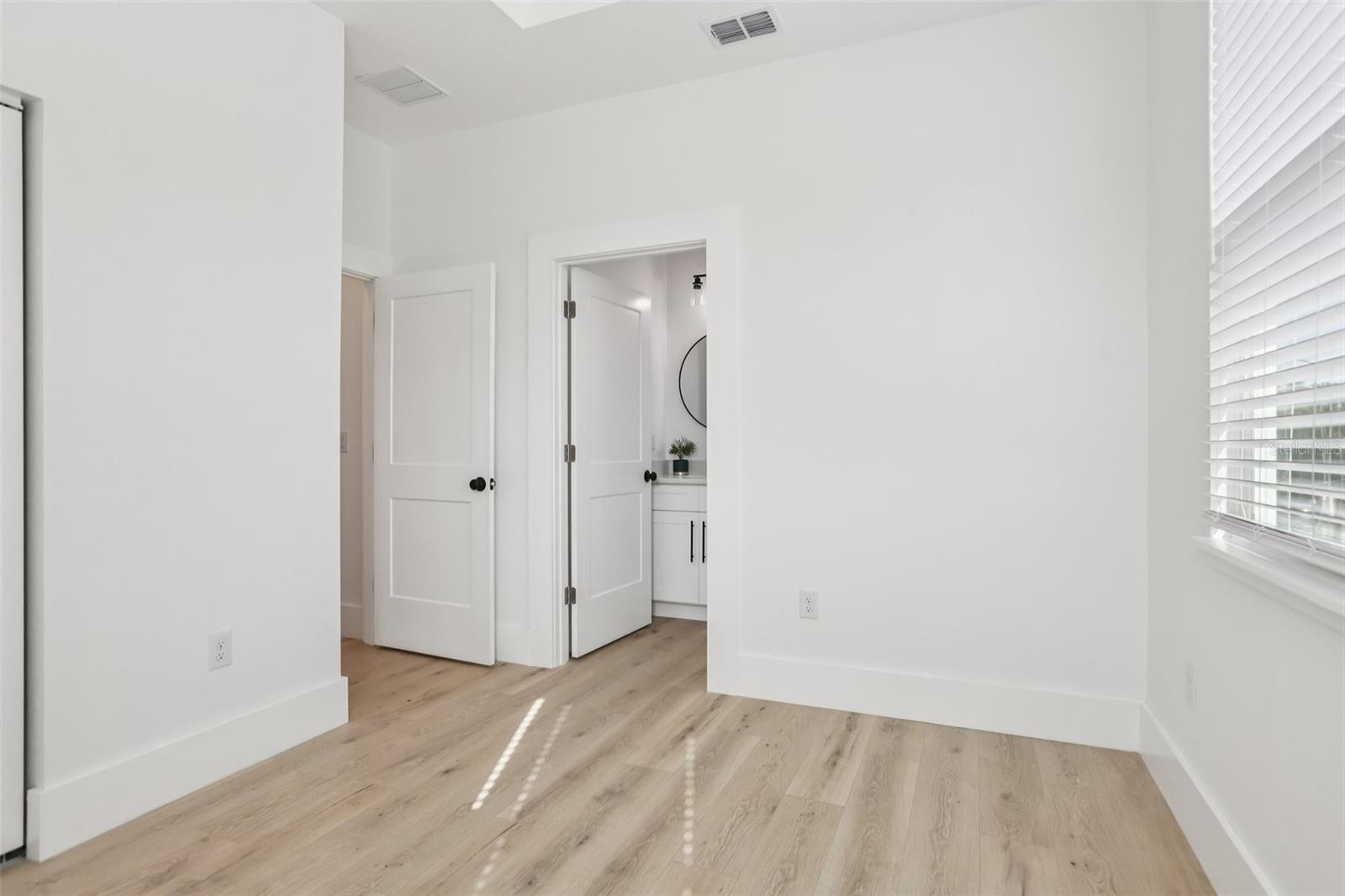 secondary bedroom w/ ensuite bath