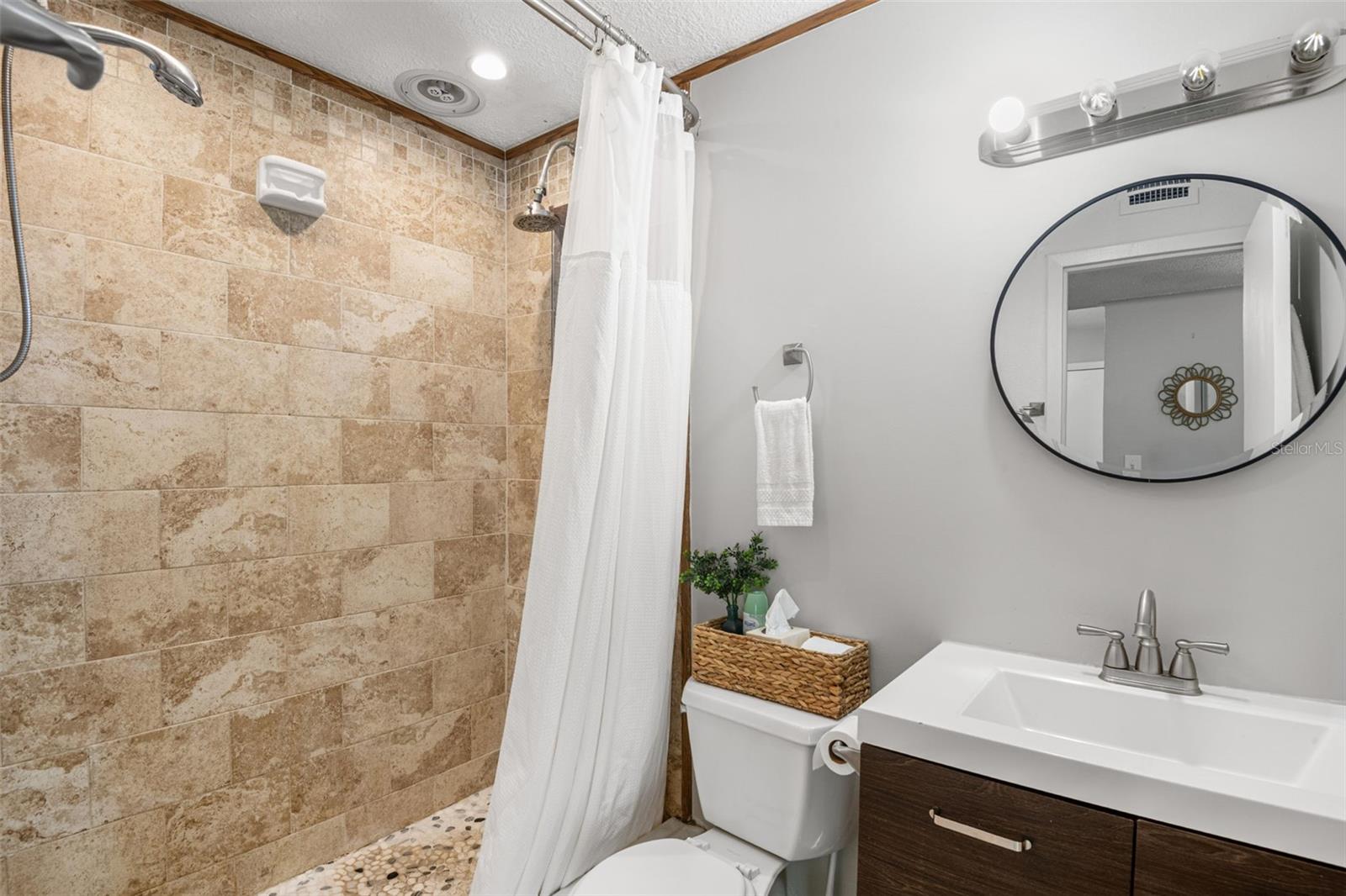 DUAL shower heads in this beautifully updated bathroom.