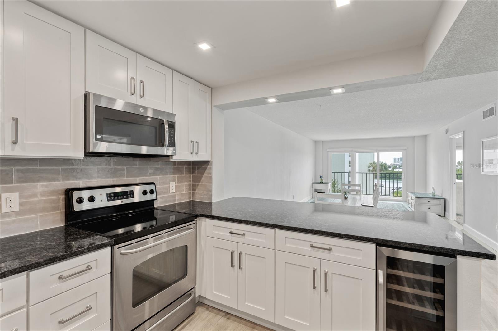 Completely renovated kitchen with built in wine fridge in the island