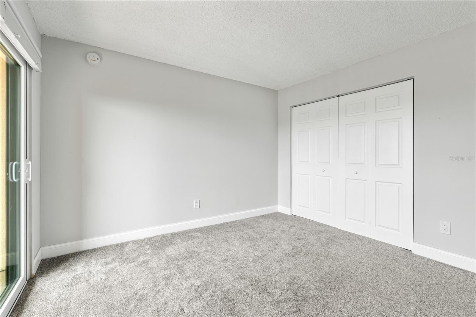 Secondary Bedroom with private balcony