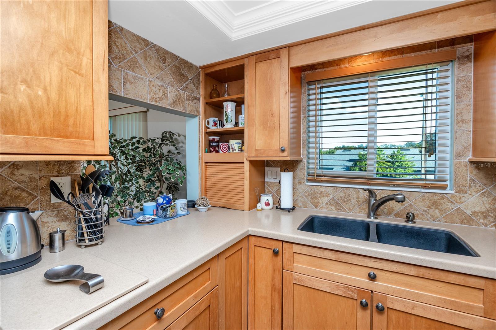 Window over looks parking lot, looks East