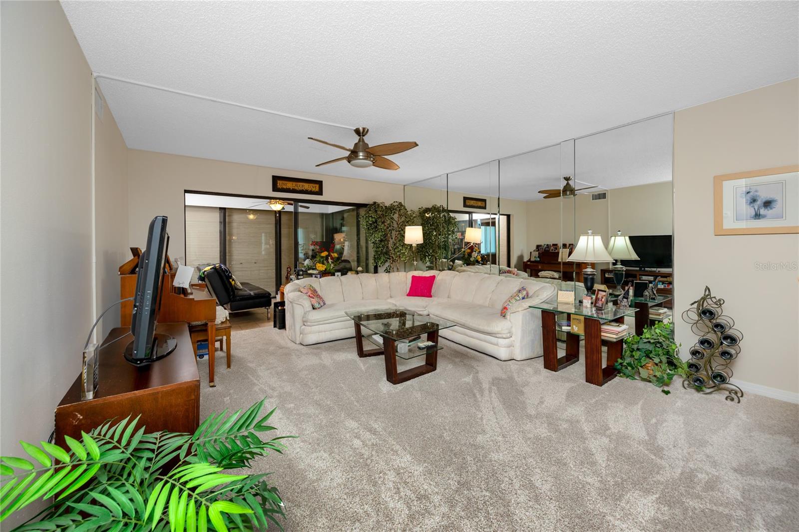 Spacious living room with access to the screened in porch