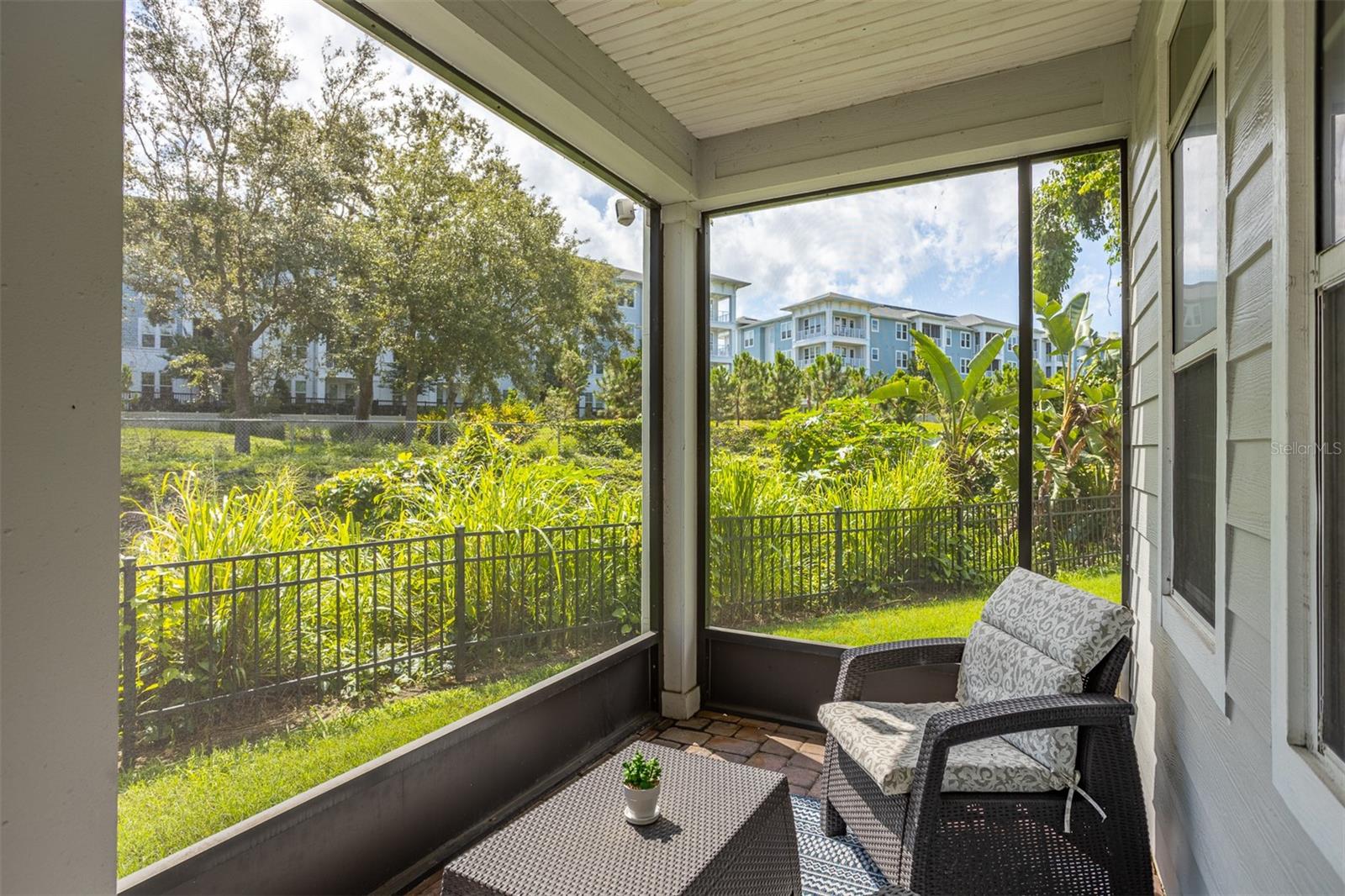 A main floor screened in patio offering stunning views of the Pinellas Trail.