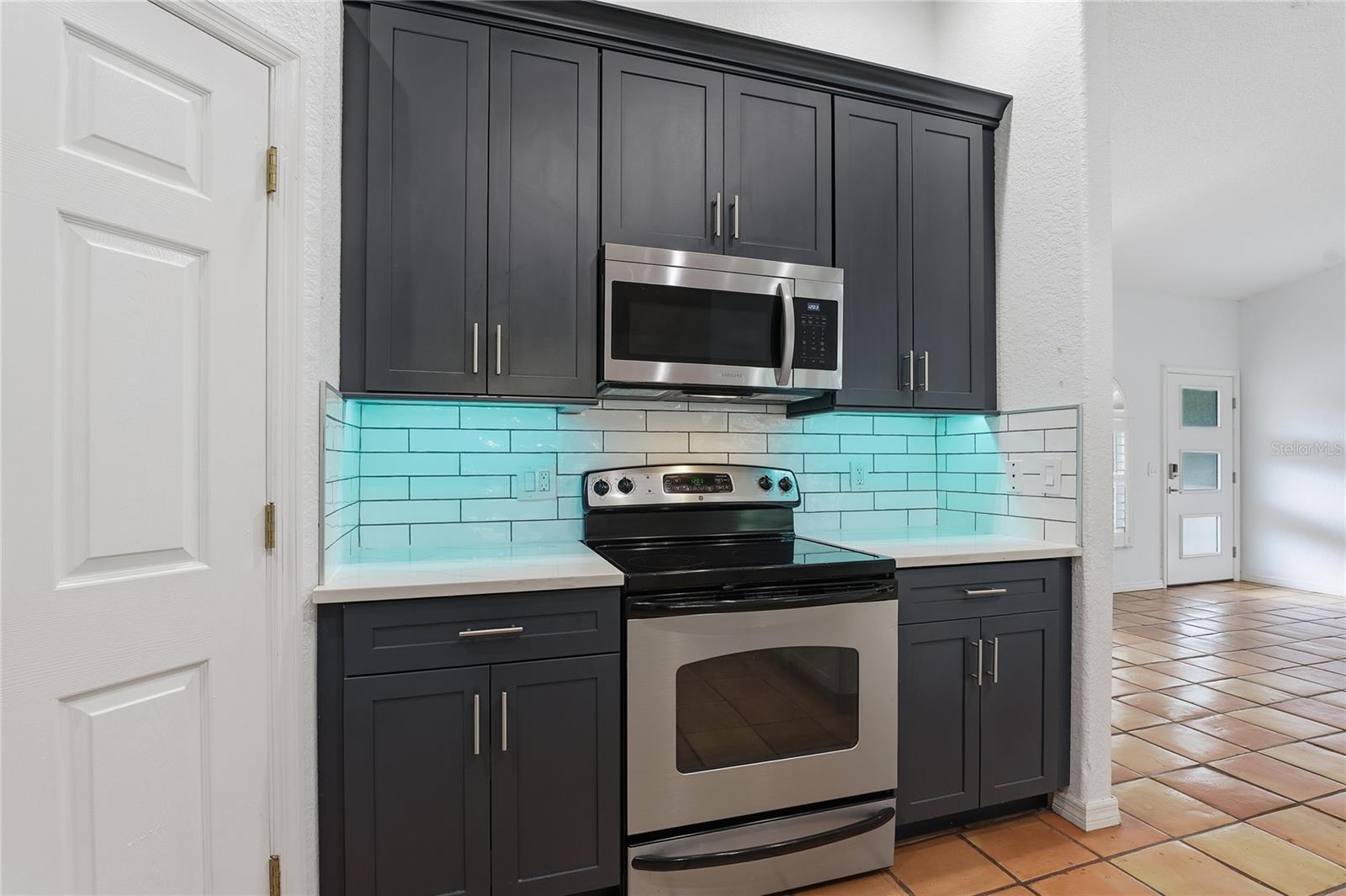 QUARTZ COUNTERTOPS AND TILE BACKSPLASH