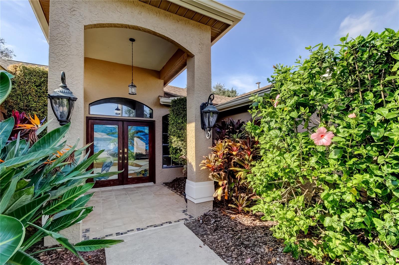 Upon entry, you are welcomed by soaring ceilings, elegant architectural accents, and a grand sense of scale!