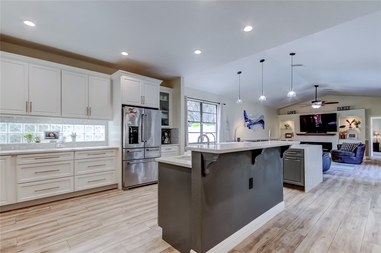 The home’s luxurious interior centers around a fully reimagined gourmet kitchen