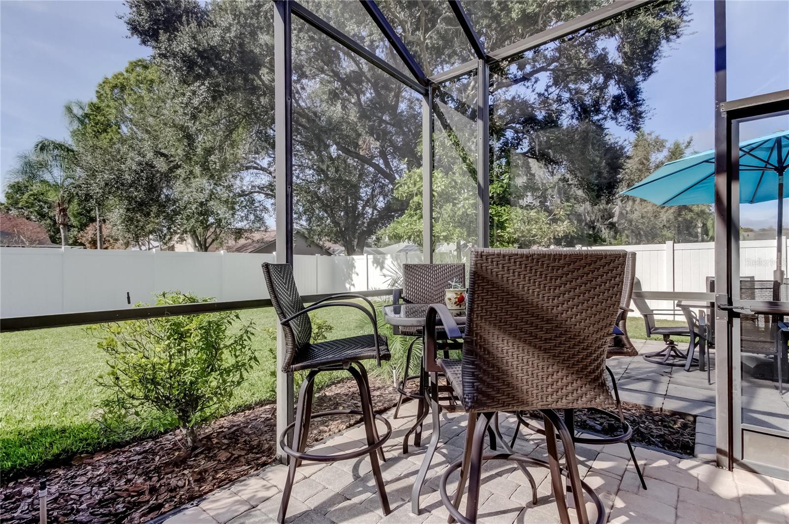 Enveloped in white vinyl six foot fencing for security and privacy