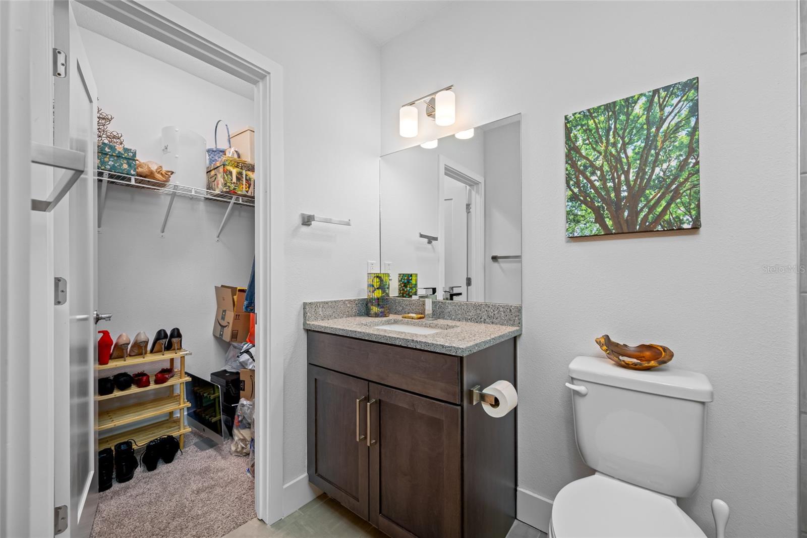 Full bathroom with walk-in shower. First Floor - Bedroom 3 with en-suite full bathroom & walk-in closet.