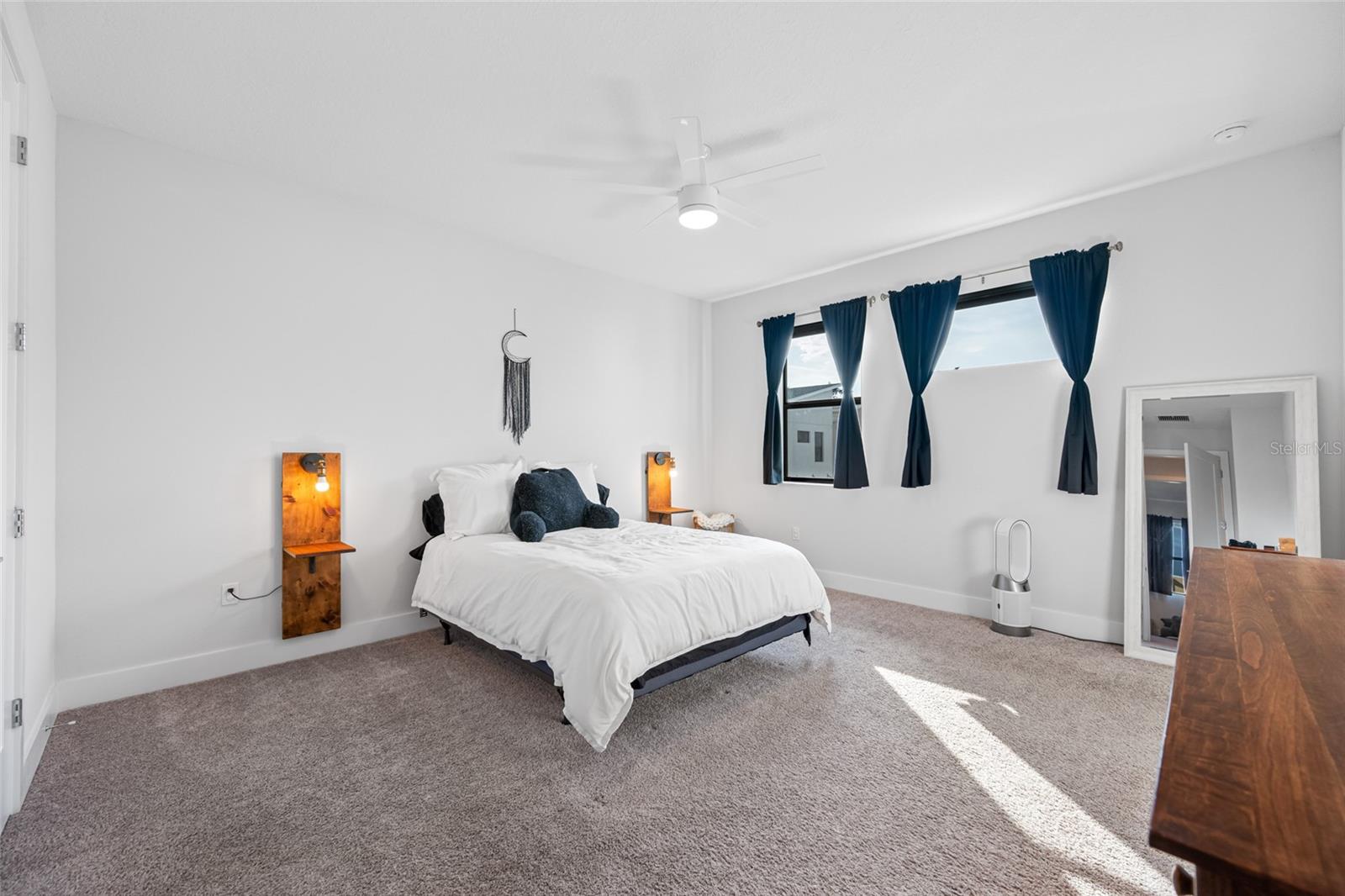 Large primary suite features 10ft ceilings, walk-in closet, ensuite bathroom with dual vanity and walk-in shower. Third Floor