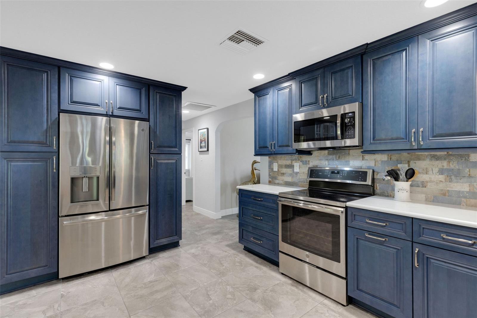 cabinets next to refrigerator have pull out shelves