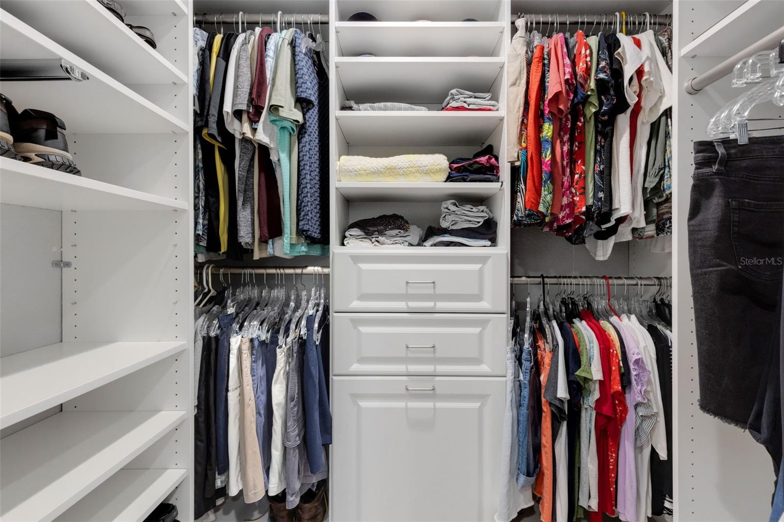 Walk in closet with shelving