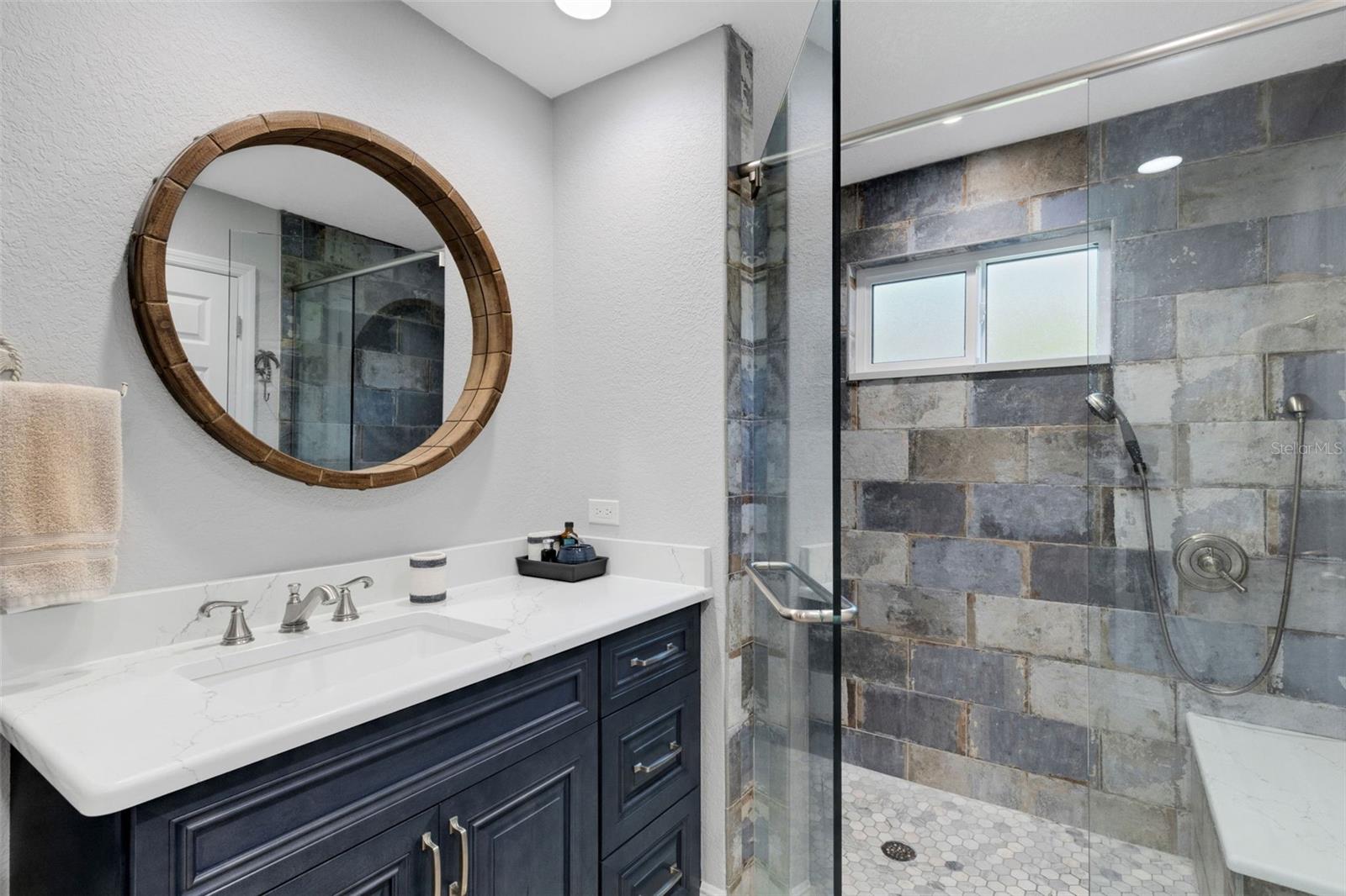 Multiple shower heads and bench