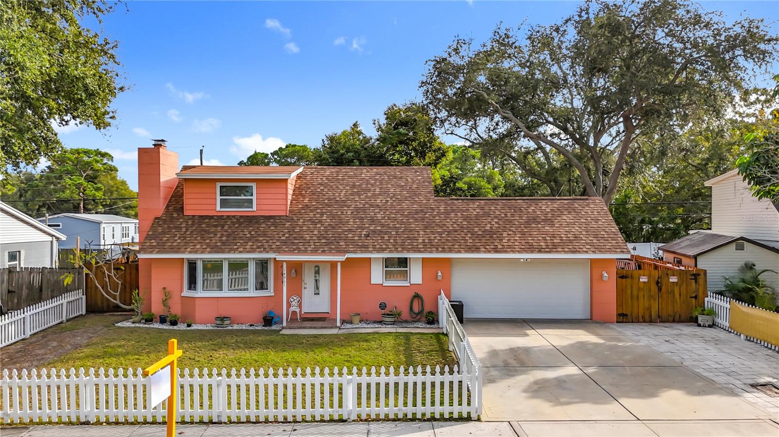 Welcome to 14961 Newport Rd. 4 bedrooms, 1.5 baths, 2 car garage with above ground pool, located in Unincorporated Pinellas County ( short term rentals allowed with application). Please take note of the extra parking pad, the paver area to the right. The Double gate allows discrete storage for a trailer, small boat or RV