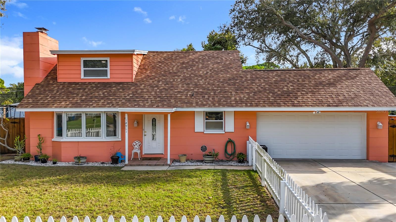 Please take note of the bay windows, those are in the living room and those are highly desirable Pella windows, with built in blinds. The window just to the left of the garage is the updated kitchen.